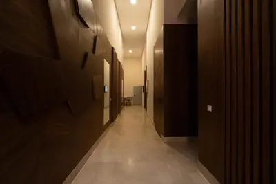 a hallway with wooden walls and a long hallway with a hallway at Suite Apt Bourgogne N°2, 2 P in Casablanca
