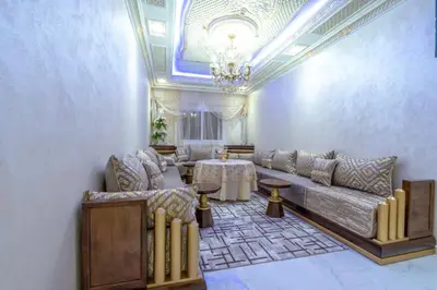 a large living room with couches and a table at Laura Residence in Bouznika