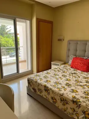 a bedroom with a bed and a large window at Belle Villa à Bouznika plage - Golf Bouzbay in Bouznika