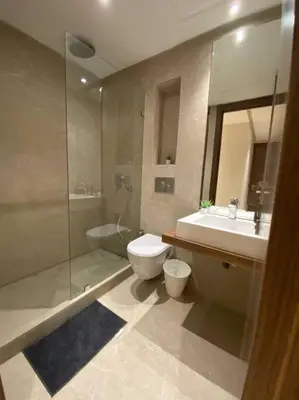 a bathroom with a toilet and a sink and a shower at Glamorous Habous - By AppartAli in Casablanca