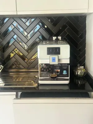 a coffee maker on a shelf in a kitchen at Le Carrousel Appartement in front of the see in Rabat