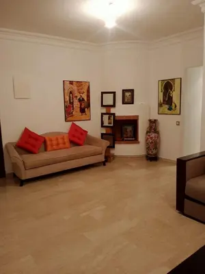 a living room with a couch and a fireplace at Bel appartement à skhirat plage et à 20 mn de Rabat in Skhirat