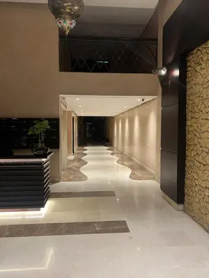 a hallway of a building with a long corridor at Appartement Cozy au Triangle d’or in Casablanca