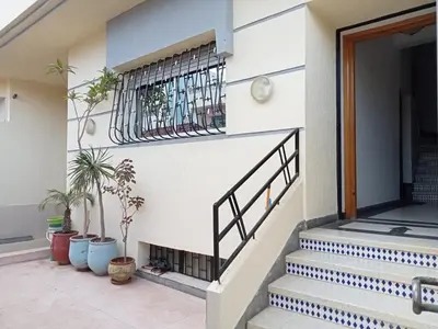 a staircase in a house with potted plants at Maison indépendante 100m2 à Témara centre in Temara