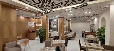 a restaurant with tables and chairs in a room at Unico Hotel & Spa Casablanca in Casablanca