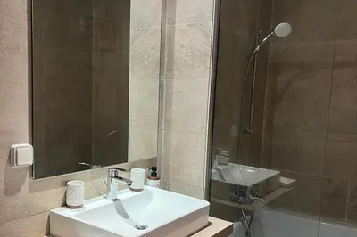 a bathroom with a sink and a shower at 2 Bed Apartment - Balcony Parking Wifi in Casablanca