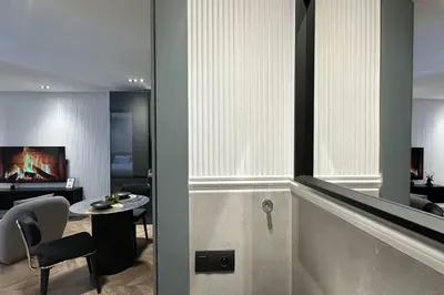 a room with a table and a living room at Touch of Luxury - By AppartAli in Casablanca