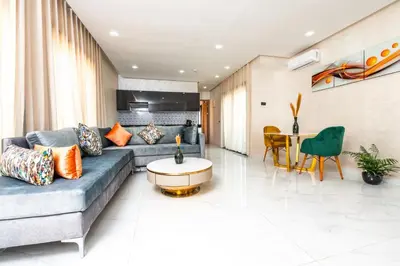 a living room with a couch and a table at maarif elite suite in Casablanca