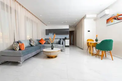 a living room with a couch and a table at maarif elite suite in Casablanca