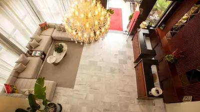 an overhead view of a living room with a chandelier at Fourteen Hotel Ain Sebaa in Casablanca