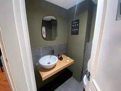 a bathroom with a sink and a mirror at Loft51 in Casablanca
