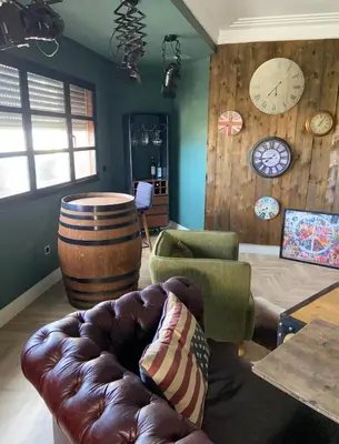 a living room with a couch and a barrel at Loft51 in Casablanca