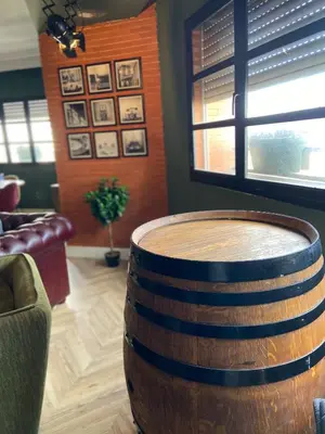 a large wooden barrel in a living room with a couch at Loft51 in Casablanca