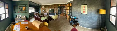 a living room with a wooden table in a room at Loft51 in Casablanca
