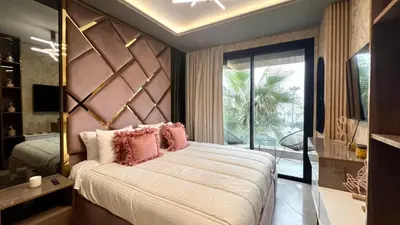 a bedroom with a large bed with pink pillows at The Address - Sunny Anfa Hills in Casablanca