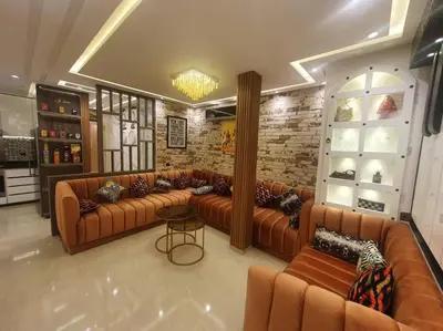 a large room with couches and tables in a store at Grand Appartement corniche in Casablanca