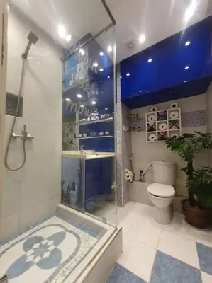 a bathroom with a shower and a toilet at Grand Appartement corniche in Casablanca