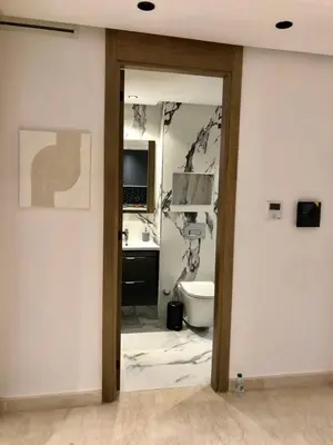 a bathroom with a toilet and a sink and a mirror at Chic Palmier - heart of town in Casablanca
