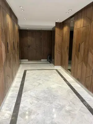 a large room with wooden walls and a marble floor at Chic Palmier - heart of town in Casablanca