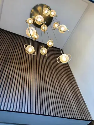 a bunch of lights hanging from a ceiling at Chic Palmier - heart of town in Casablanca