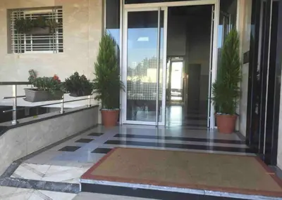 an empty lobby of a building with potted plants at Camilia Appart 2P TGV in Rabat