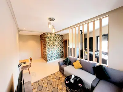 a living room with a couch and some windows at Beautiful apartment next to airport Mohamed V in Derroua