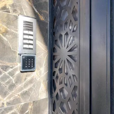 a door with a laser cut design on it at appartement moderne proche aéroport in Derroua