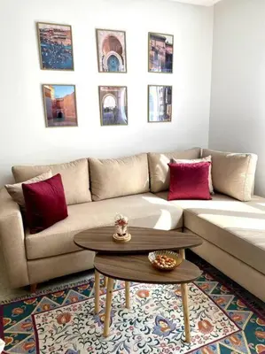 a living room with a couch and a coffee table at Jade - Appartement Luxe - Casablanca in Casablanca