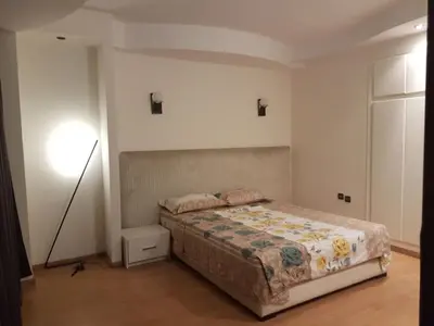a bedroom with a bed and a lamp in it at Stylish Property Perfect for Business & Leisure Trips in Casablanca