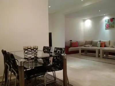 a living room with a table and a couch at Stylish Property Perfect for Business & Leisure Trips in Casablanca