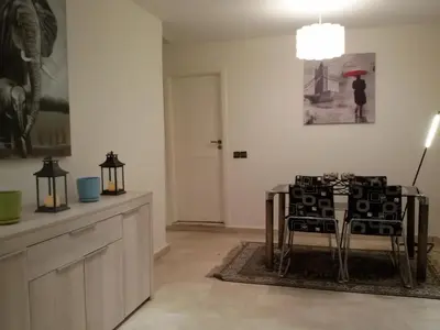 a dining room with a table and chairs in a room at Stylish Property Perfect for Business & Leisure Trips in Casablanca