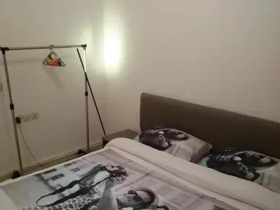 a bedroom with a bed with two people taking pictures at Stylish Property Perfect for Business & Leisure Trips in Casablanca