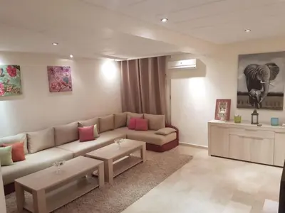 a living room with a couch and a table at Stylish Property Perfect for Business & Leisure Trips in Casablanca