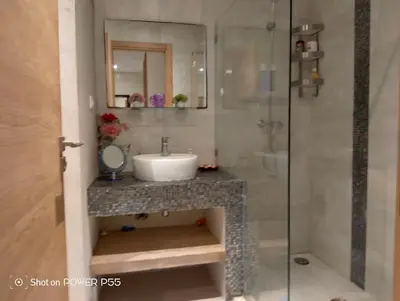 a bathroom with a sink and a shower at Résidence de vacances vue piscine plages Mimosas Sablettes in Mohammedia