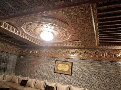 a room with a ceiling with a picture on it at Villa à la décoration marocaine in Rabat