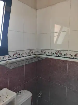 a bathroom with a toilet and a sink at Villa à la décoration marocaine in Rabat