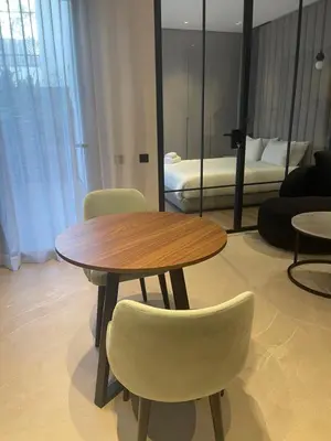 a table and chairs in a room with a bed at Magic Appartement Luxury Gauthier 04 in Casablanca