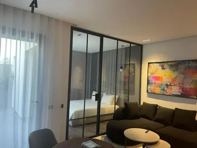 a living room with a couch and a bedroom at Magic Appartement Luxury Gauthier 04 in Casablanca