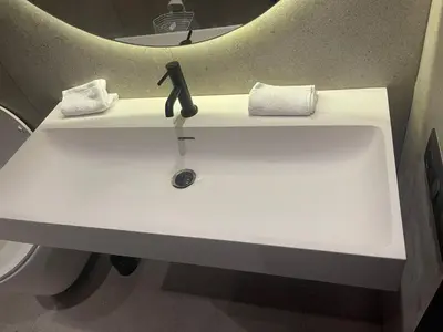 a white sink in a bathroom with a mirror at Magic Appartement Luxury Gauthier 04 in Casablanca