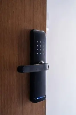 a black phone is hanging on a wooden door at New urban getaway 25 in Casablanca