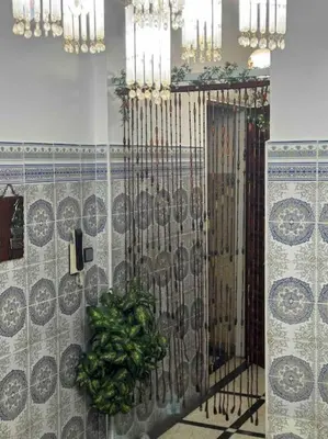 a room with a bunch of green peppers on a wall at Welcome Loc T4 in Casablanca