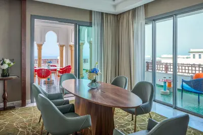 a room with a table and chairs and a large window at Four Seasons Hotel Rabat at Kasr Al Bahr in Rabat