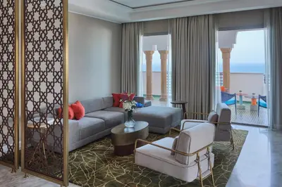 a living room with a couch and a table at Four Seasons Hotel Rabat at Kasr Al Bahr in Rabat