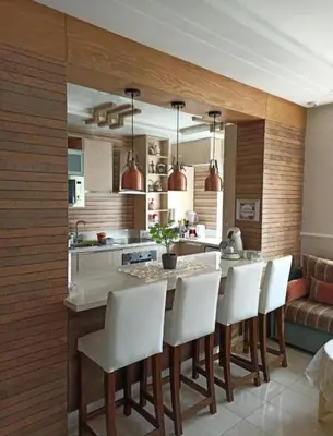 a kitchen with white chairs and a kitchen island at home & room center of rabat in Rabat