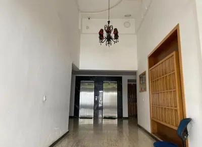 an empty hallway with a chandelier in a building at home & room center of rabat in Rabat