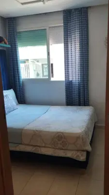 a bedroom with a bed and a window at home & room center of rabat in Rabat