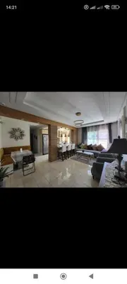 a large living room with couches and a dining room at home & room center of rabat in Rabat
