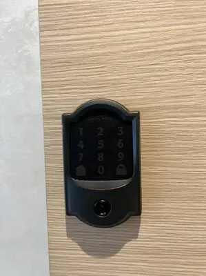 a black remote control sitting on a wooden surface at Luxurious Close to all attractions in Casablanca