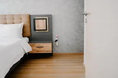 a bedroom with a bed and a table with a mirror at Luxurious Close to all attractions in Casablanca