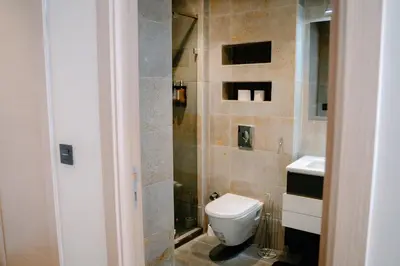 a bathroom with a toilet and a sink at Luxurious Close to all attractions in Casablanca